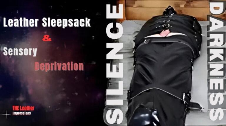 Person fully restrained in a black leather sleepsack on a padded table, emphasizing themes of silence, darkness, and sensory deprivation. Text overlay highlights "Leather Sleepsack & Sensory Deprivation" from The Leather Impressions.